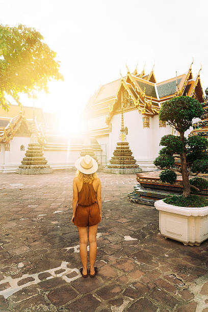 istock Woman walking in Wat Pho temple 622324910