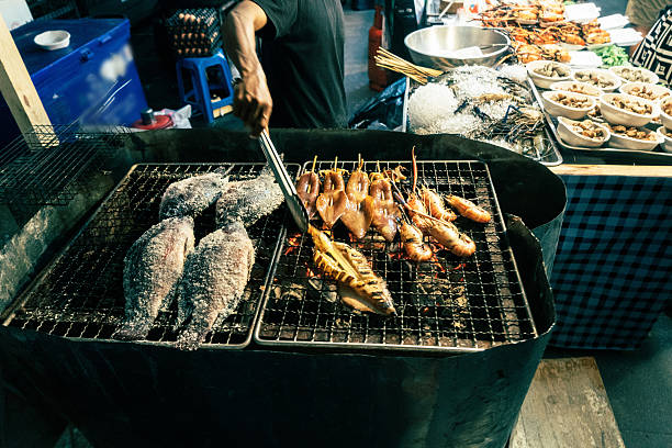 Fish on grill in Bangkok market, Thailand 