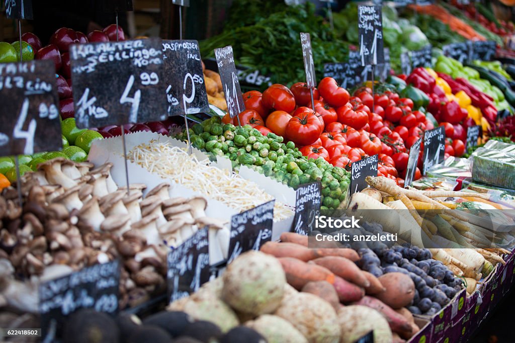 Market stall with fresh vegetables in Austria rich and colorful vegetables at the Naschmarkt in Vienna Market - Retail Space Stock Photo