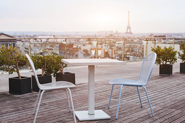 restaurant in Paris beautiful luxury rooftop restaurant in Paris with panoramic view of the city nice france restaurant stock pictures, royalty-free photos & images