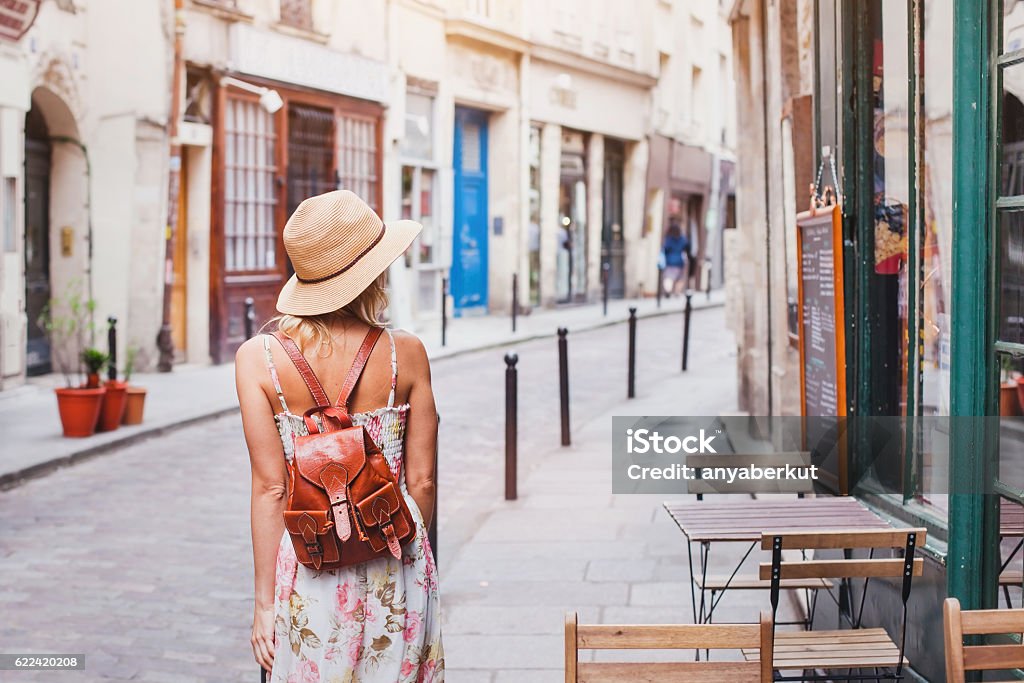 woman tourist on the street traveling in Europe woman tourist on the street, summer fashion style, travel to Europe Women Stock Photo