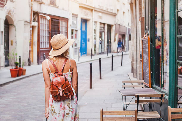 woman tourist on the street traveling in Europe woman tourist on the street, summer fashion style, travel to Europe restaurant france stock pictures, royalty-free photos & images