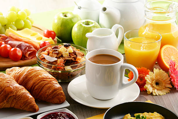 istock Breakfast served with coffee, juice, egg, and rolls 622423198