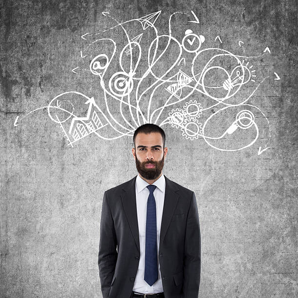 istock Businessman standing in front of wall 622423614