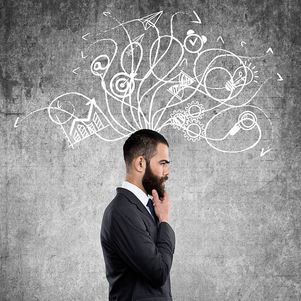 istock Businessman standing in front of wall 622423962