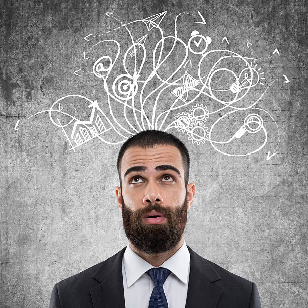 istock Businessman standing in front of wall 622425326