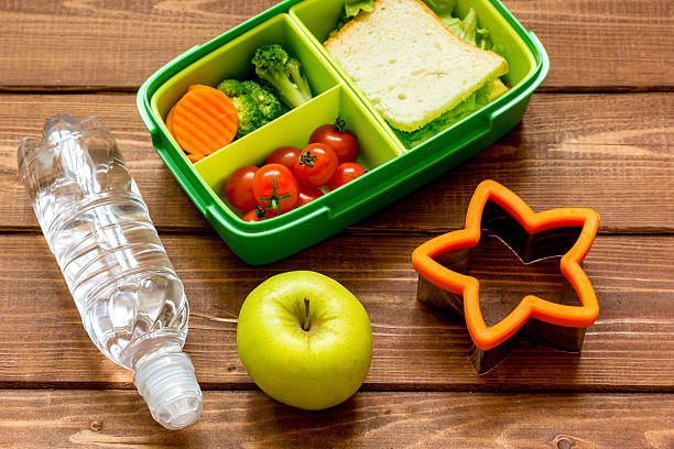 istock lunch box for kid with fresh vegetables on wooden background 622426506