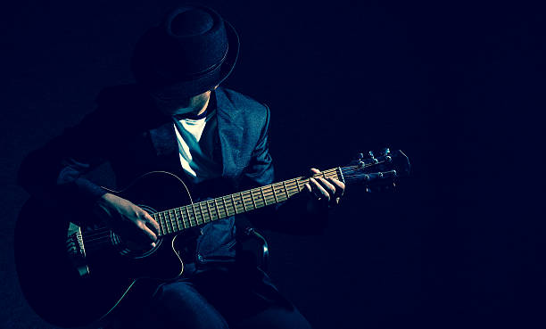 musician playing the guitar on black background,music concept - classic rock imagens e fotografias de stock