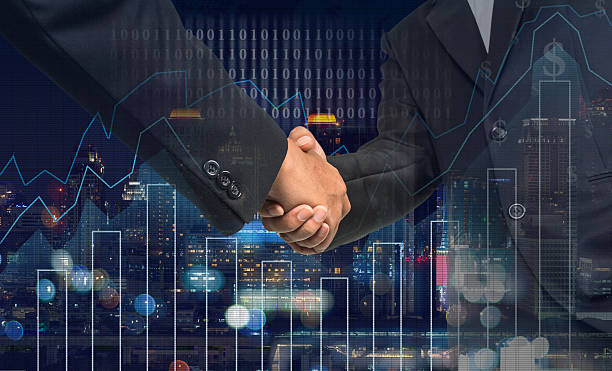 istock Hand shake between businessman on Trading graph on the cityscape 622427386