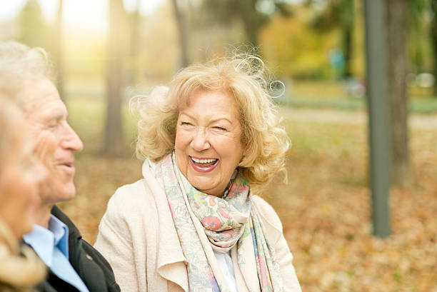 istock Three smiling seniors enjoying at park. 622428054