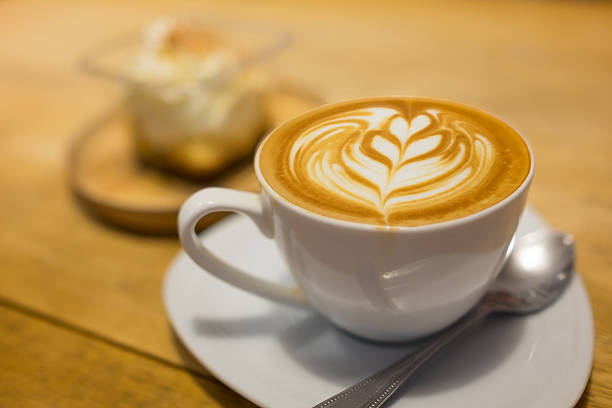 istock Coffee latte art on wood table 622429298