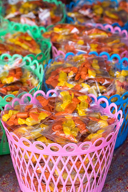 istock Coconut toffee in colorful packaging. Traditional Thai candy. 622429366