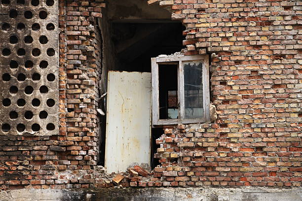 shell of a house with red bricks.