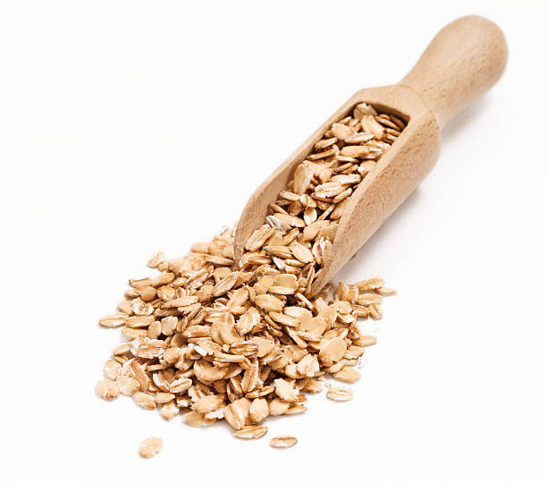 istock Uncooked oatmeal in wooden scoop 622430820