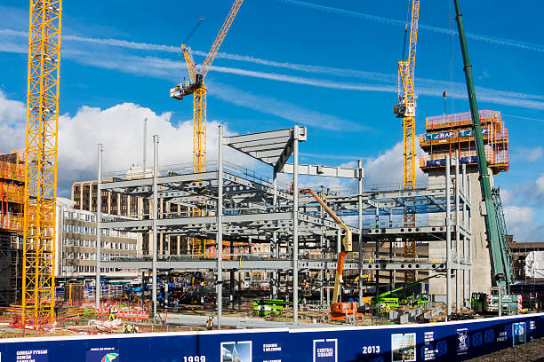 progress on the construction site in cardiff - editorial land vehicle construction equipment built structure imagens e fotografias de stock