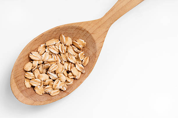 istock Wooden spoon with oat flakes 622430964