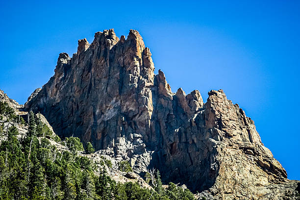 Jagged Peaks against a Bright Blue Sky stock photo