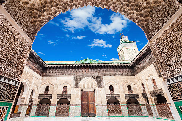 Madrasa Bou Inania The Medersa Bou Inania is a madrasa in Fes, Morocco. Medersa Bou Inania is acknowledged as an excellent example of Marinid architecture. fez morocco stock pictures, royalty-free photos & images