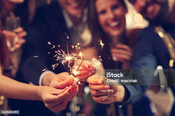 Group Of Friends Having Fun With Sparklers Stock Photo - Download Image Now - Sparkler - Firework, Celebration, Party - Social Event