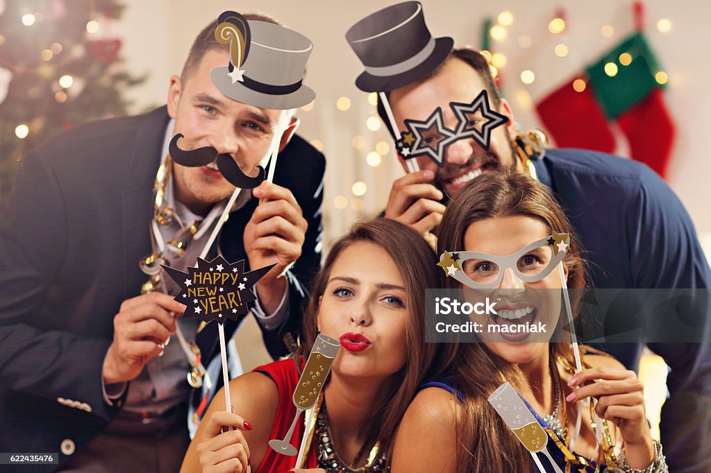 Group of friends celebrating New Year Picture showing group of friends celebrating New Year Adult Stock Photo