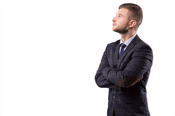 istock Young man in a suit looking up 622438156