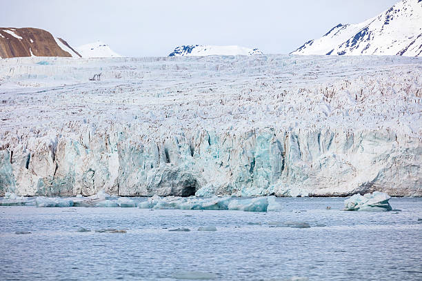 Close-up of the large and massive Borebreen glacier from the sea. Arctic environment in Oscar II Land at Spitsbergen, Svalbard. Melting ice and global warming.