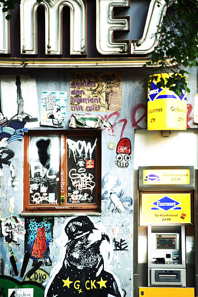 Graffiti in Berlin Friedrichshain Berlin, Germany - May 09, 2016: Graffiti and cartoon style street art next to an ATM money machine in Friedrichshain on May 09, 2016 in Berlin. friedrichshain photos stock pictures, royalty-free photos & images