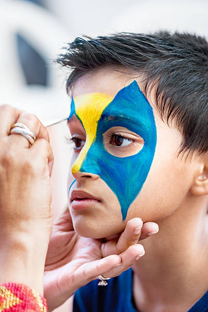 istock Nine year boy child young having face painted birthday party 622439348