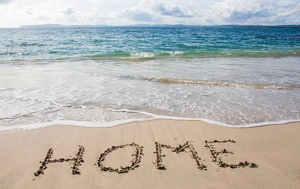 istock Home written in the sand on the beach 622439822
