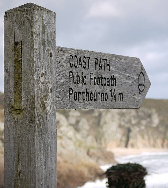 istock Wooden Coast Path public footpath sign to Porthcurno cornwall 622440222