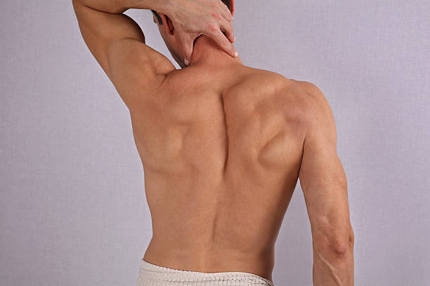 Muscular male back, torso, chest and armpit hair removal. stock photo
