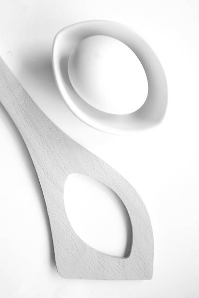 istock High key egg in a bowl and wooden spoon 622441022