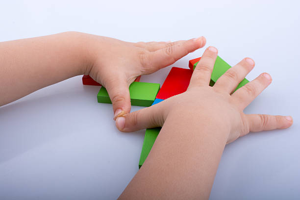 istock Hand holding color dominoes 622443320