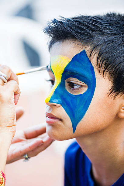 istock Nine year boy child young having face painted birthday party 622443508