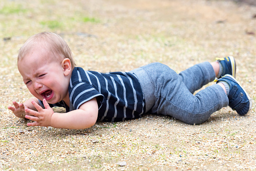 fallen crying baby at the park