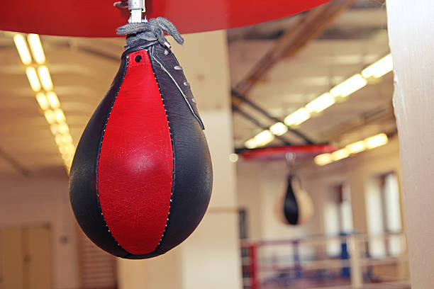 istock Red and black punching bag with gym background 622446124