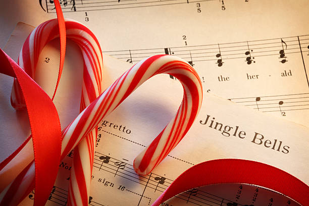 istock Jingle Bells Sheet Music With Red Ribbon And Candy Canes 622448010