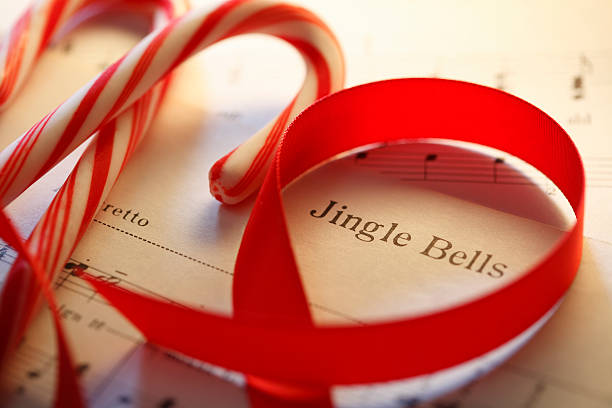istock Jingle Bells Sheet Music With Red Ribbon And Candy Canes 622448280