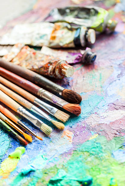 istock oil paints and paint brushes on a palette 622449736