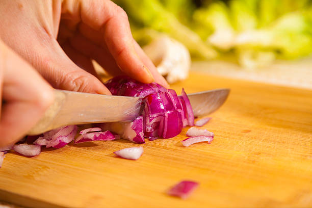 istock cropped onion with other vegetables on a cutting board 622450060