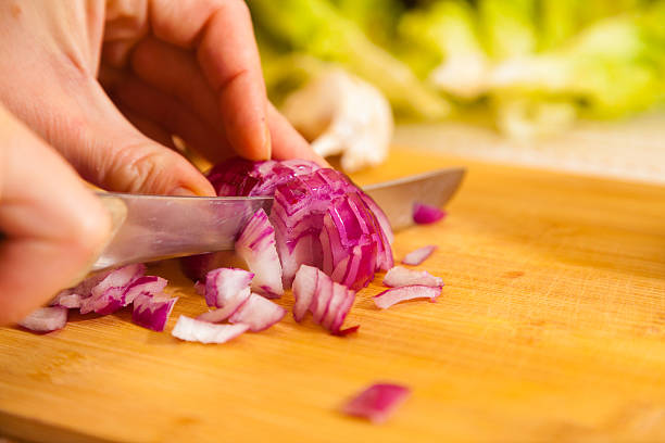 istock cropped onion with other vegetables on a cutting board 622450150