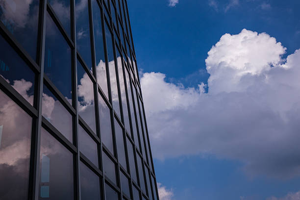 istock Reflection sky and clouds in the windows of  building 622452414