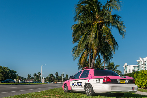 Miami Beach, USA - November 11, 2016: North Bay Village Police Department supporting Breast Cancer Awareness in Miami Beach, Florida. This pinky unit was seen in front of Channel 7 News in a quiet morning.