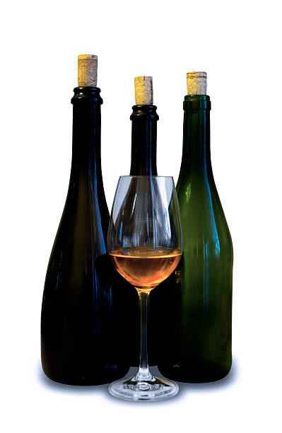 istock Three dark bottles with glass of wine 622456846