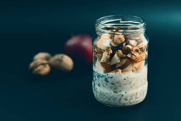 istock Preparation overnight breakfast with flakes of oats, chia, apple, nuts. 622457050