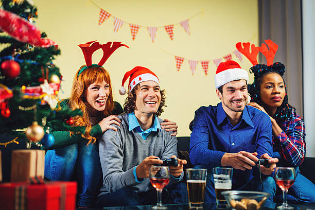 istock Group of young people playing interactive video games 622457528