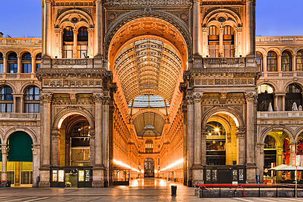 Milan Gallery Entrance Close Entrance portico and facade of Vittorio Emmanuele gallery shopping district in Milan, Italy - the oldest shopping mall in the world on Cathedral square. galleria vittorio emanuele ii stock pictures, royalty-free photos & images