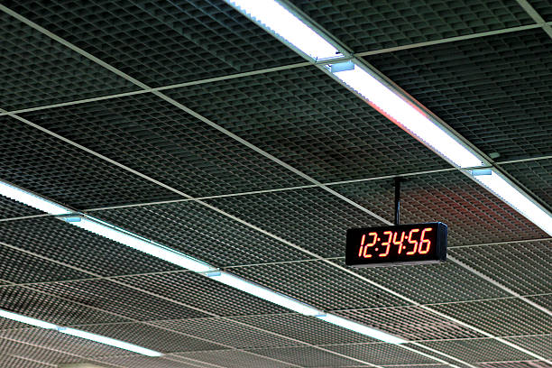 istock digital clock show time 12:34:56 on the ceiling. 622506946
