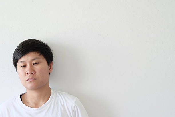 istock Young Asian human close up on white 622508522