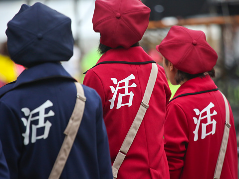 Tokyo, Japan - October 8, 2016: Rearview of female participants wearing costume with single Chinese character on the back on the street at the 17th Tokyo Yosakoi in Ikebukuro.